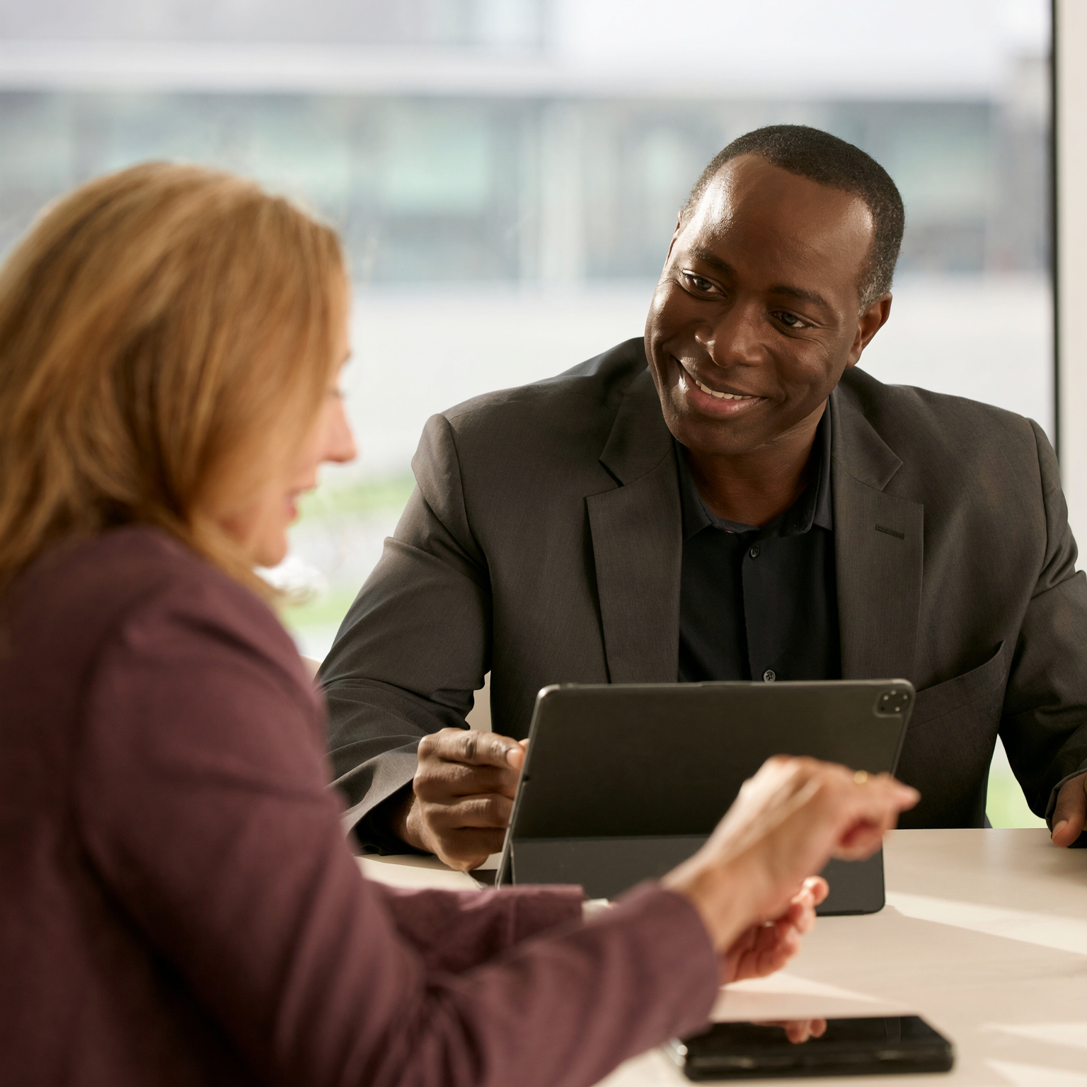 A solicitor and client reviewing an estate case together